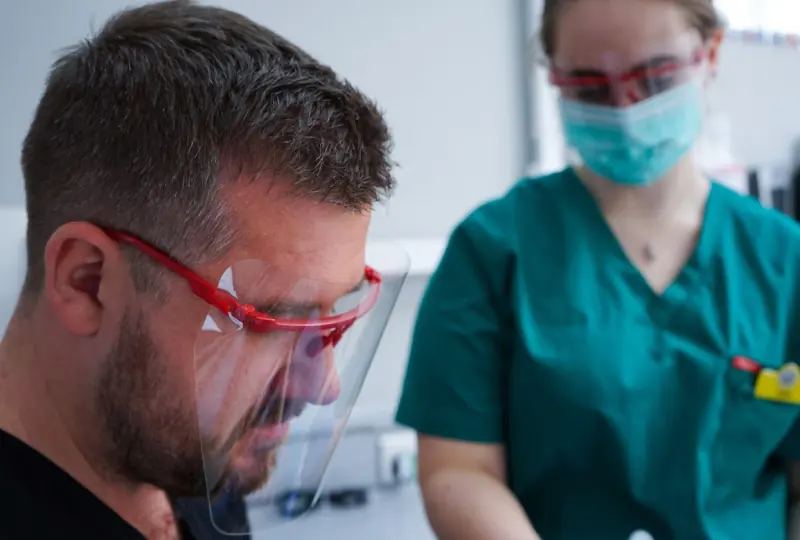 A patient and a dental nurse in the surgery