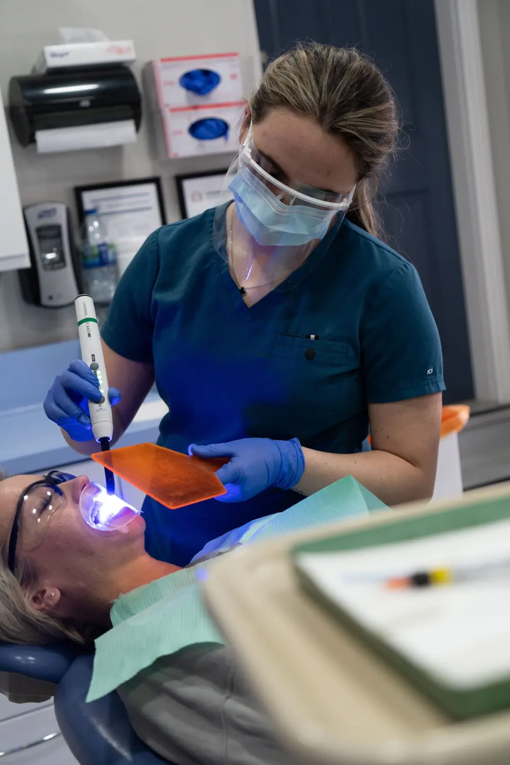 A hygienist carrying out a whitening treatment